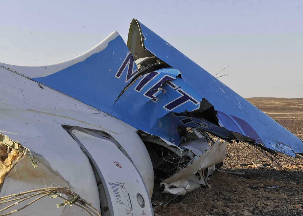 This image released by the Prime Minister's office shows the tail of a Metrojet plane that crashed in Hassana Egypt, Friday, Oct. 31, 2015. The Russian aircraft carrying 224 people, including 17 children, crashed Saturday in a remote mountainous region in the Sinai Peninsula about 20 minutes after taking off from a Red Sea resort popular with Russian tourists, the Egyptian government said. There were no survivors.(Suliman el-Oteify, Egypt Prime Minister's Office via AP)